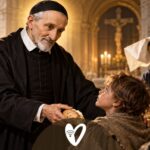 San Vicente de Paúl comparte el pan con los pobres durante una celebración de la caridad